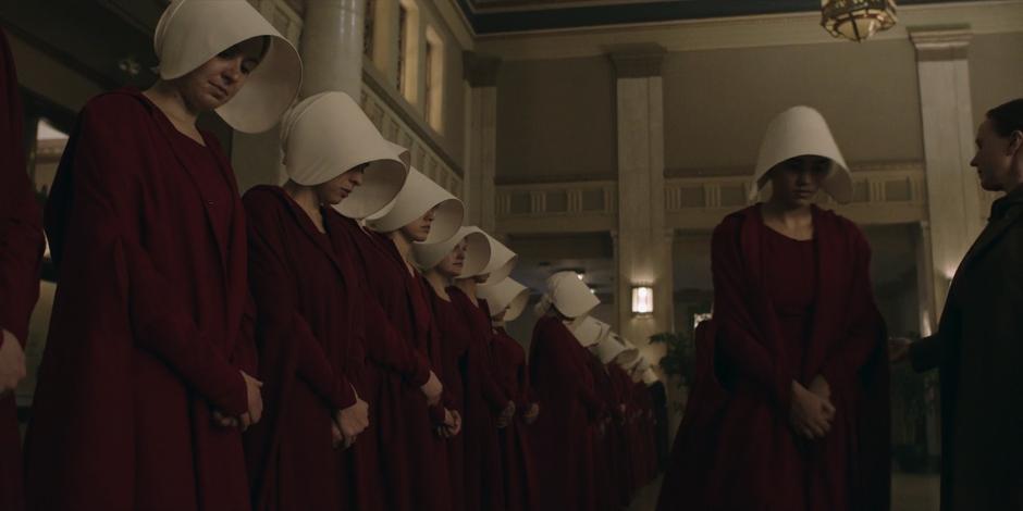 Aunt Lydia tells the visibly damaged handmaids to leave.