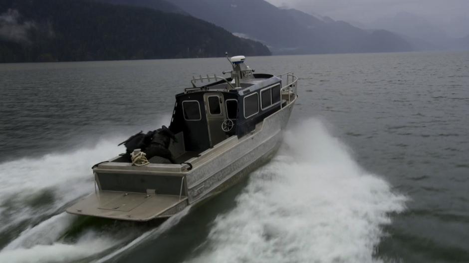 Oliver fights with Chase on the back of the speeding boat.