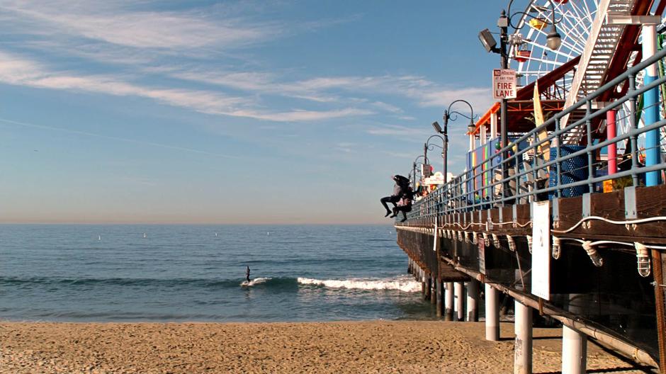 Lucifer leaps off the pier with his mother while time is stopped.