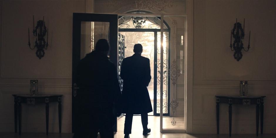 Commander Putnam is escorted from his home by the Eyes.