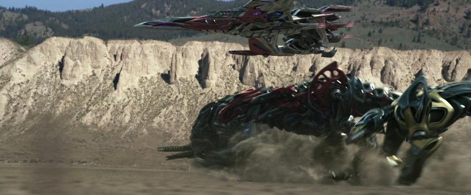 The assembled Zords run across the desert towards the town.