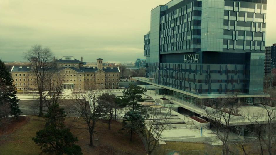 Aerial establishing shot of the back of the Dyad building.