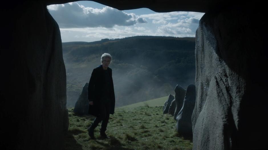 The Doctor looks back into the cairn after emerging several days later.