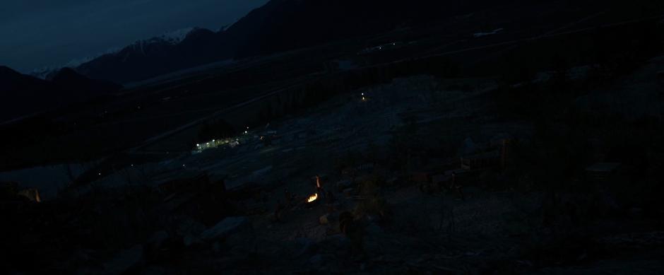 The Rangers sit around a campfire high above the mine sharing stories.