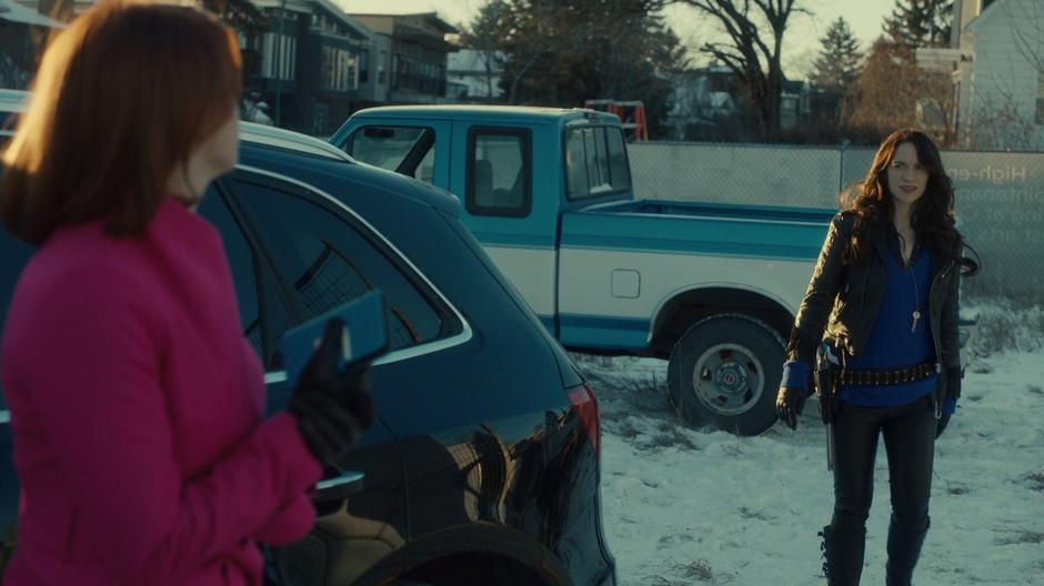 Wynonna looks surprised when she sees Mercedes Gardner standing out front of the construction site.