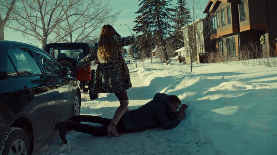 Waverly steps over Tucker who is on the ground after she went all Gooverly on his ass.