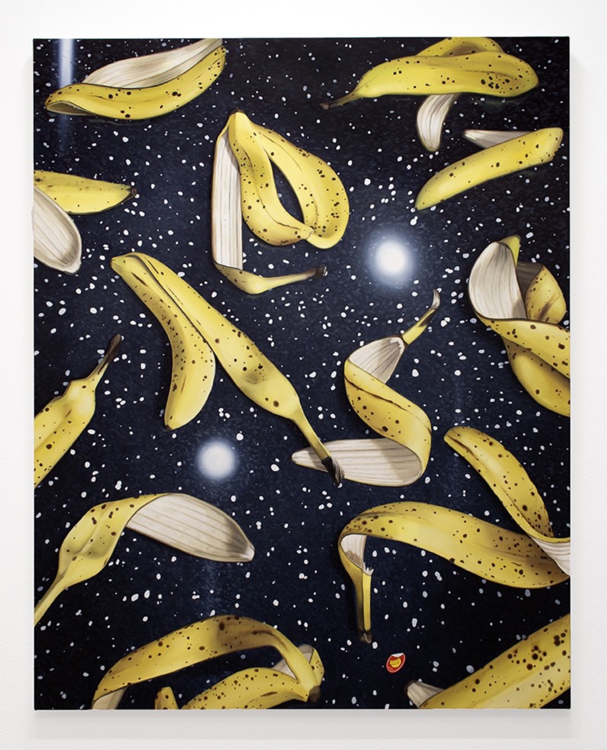 Painting of banana peels on black granite countertop