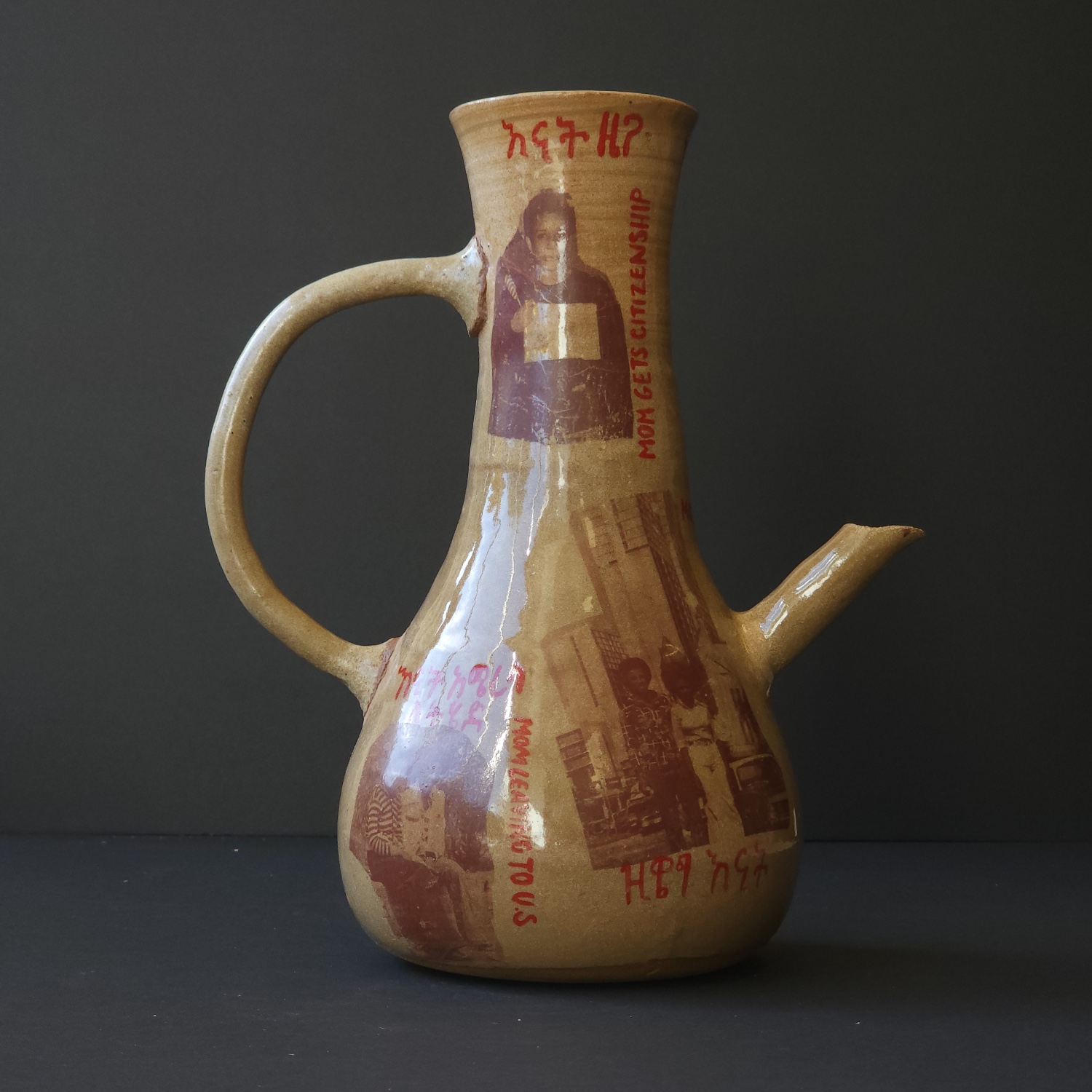 Beige serving vessel printed with old photographs and "Mom gets citizenship" in red paint