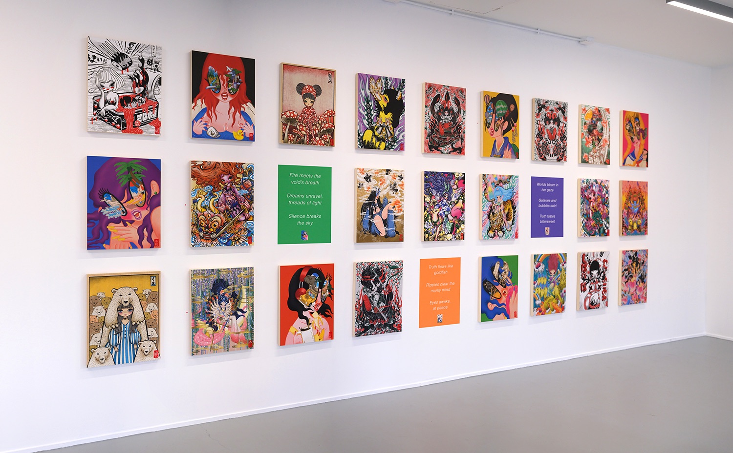 Grid of colorful artworks on a gallery wall