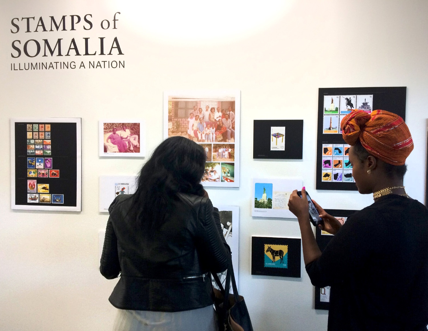 People look at an exhibition of "Stamps of Somalia"