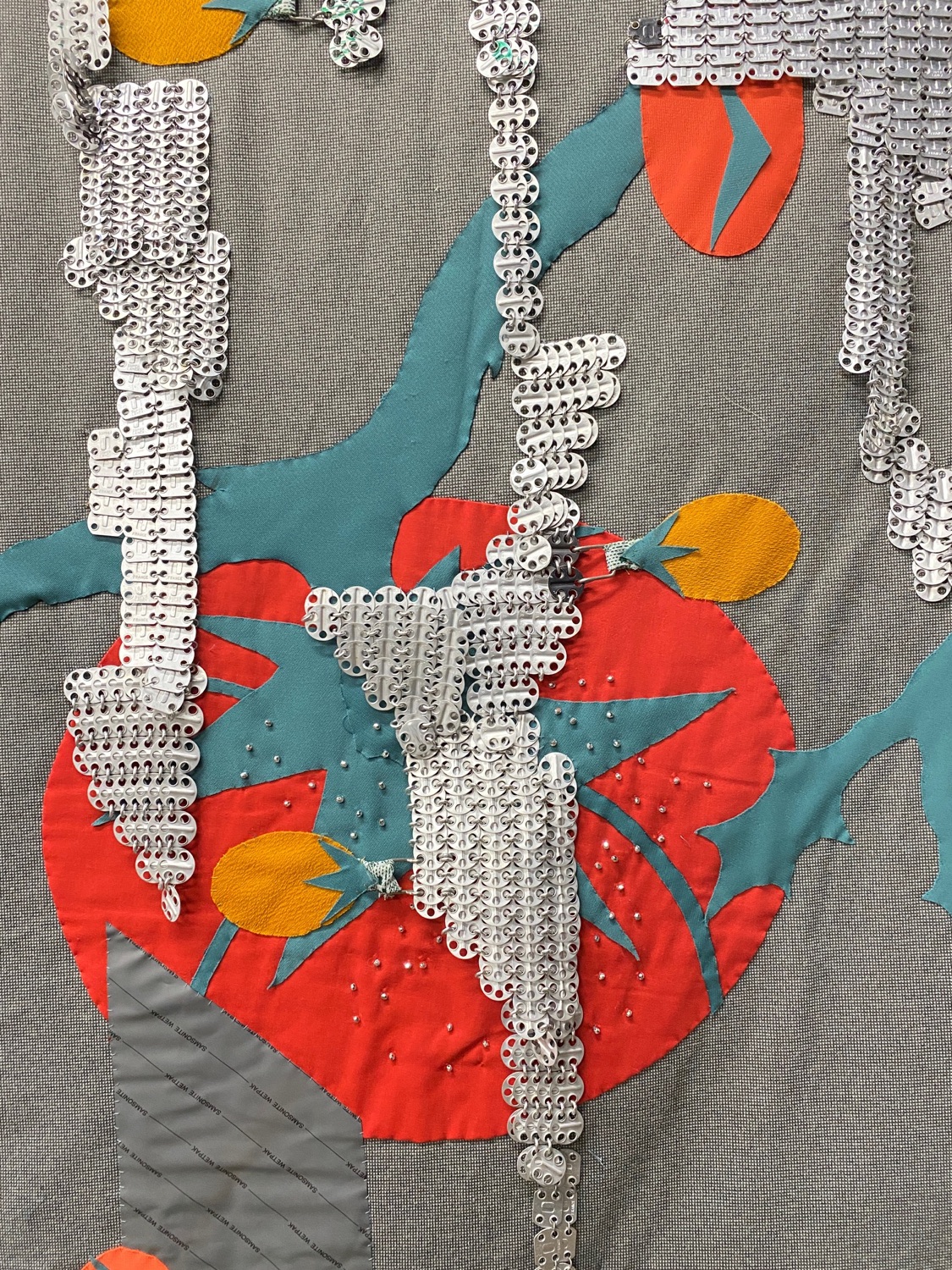 Quilt with aluminum chain mail and red tomatos