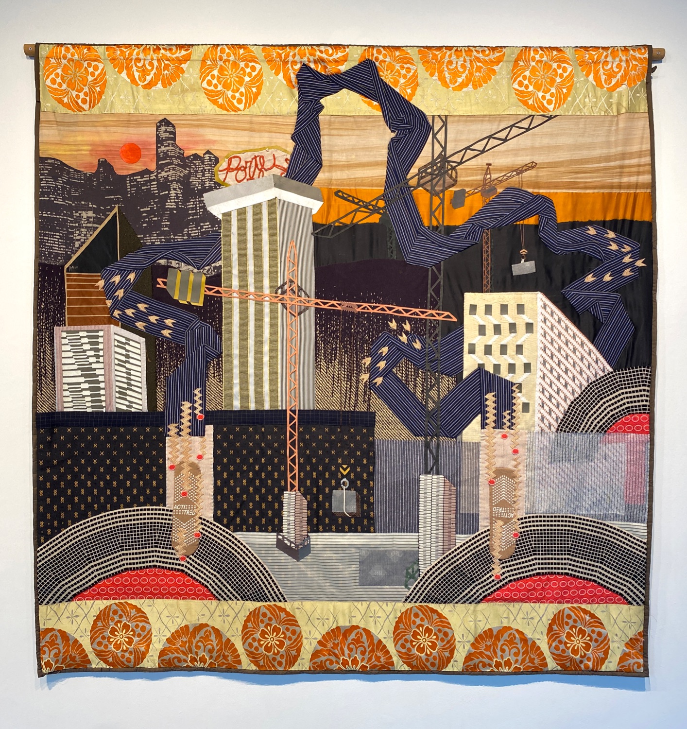 Hand-sewn tapestry of skyscrapers under construction