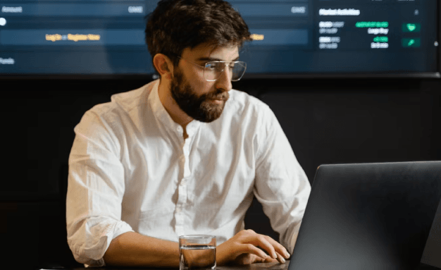 A man sitting in front of his computer