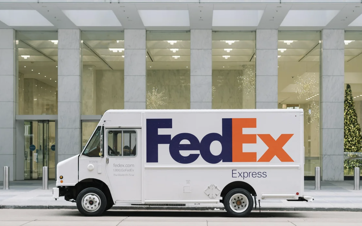 FedEx truck in front of a hotel