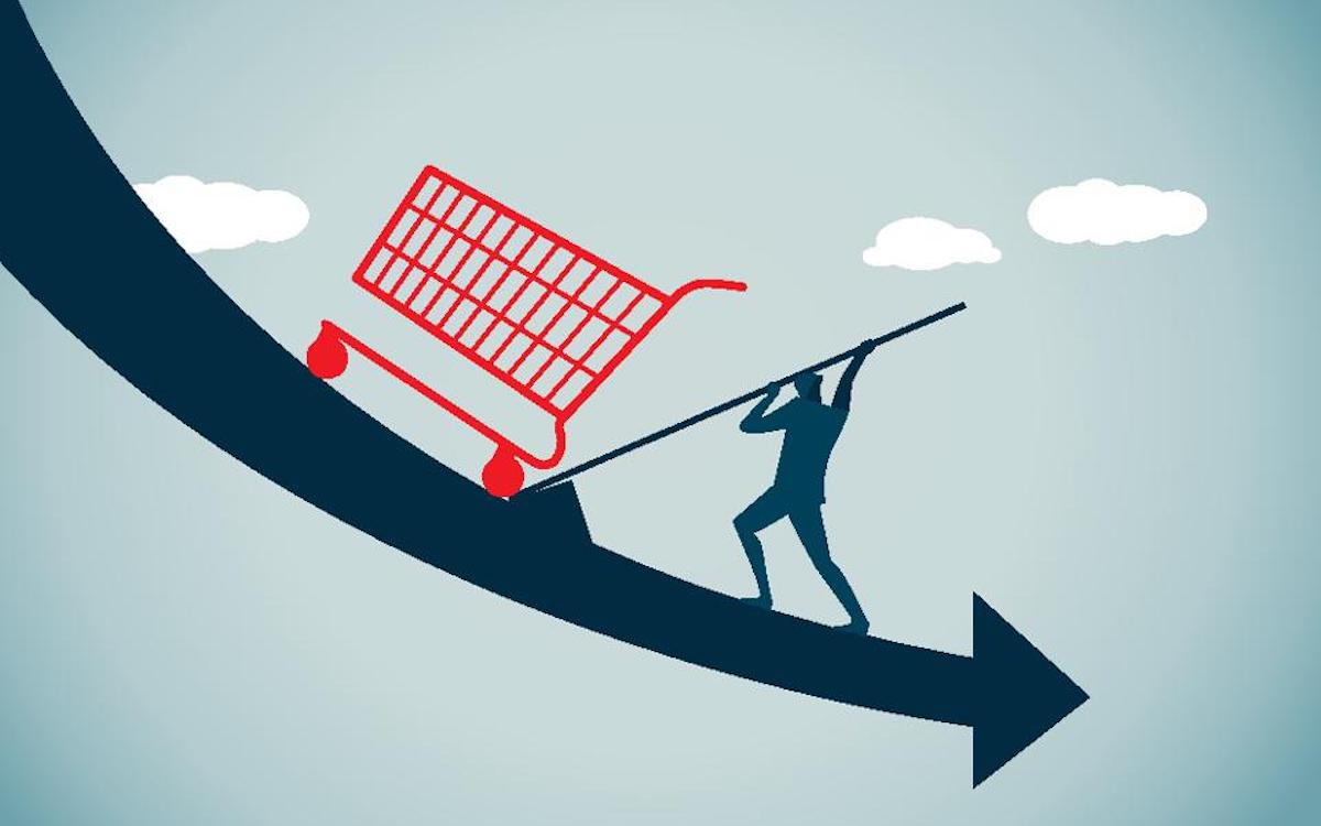 Graphic of a man pushing a shopping cart up a hill with an arrow pointing downward