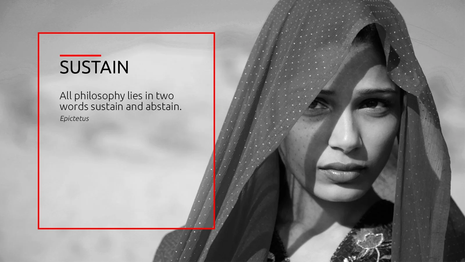 A woman working on a sewing machine at a training center.