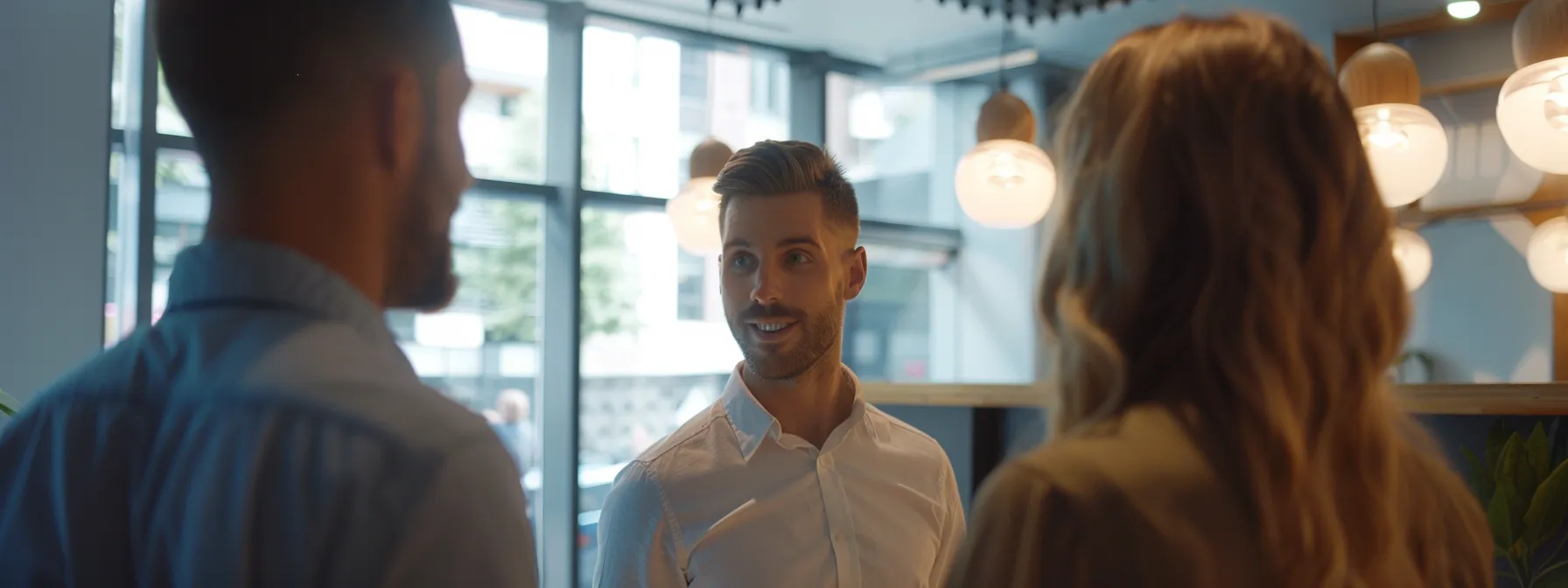 Two employees discussing strategies with their customer reference manager.