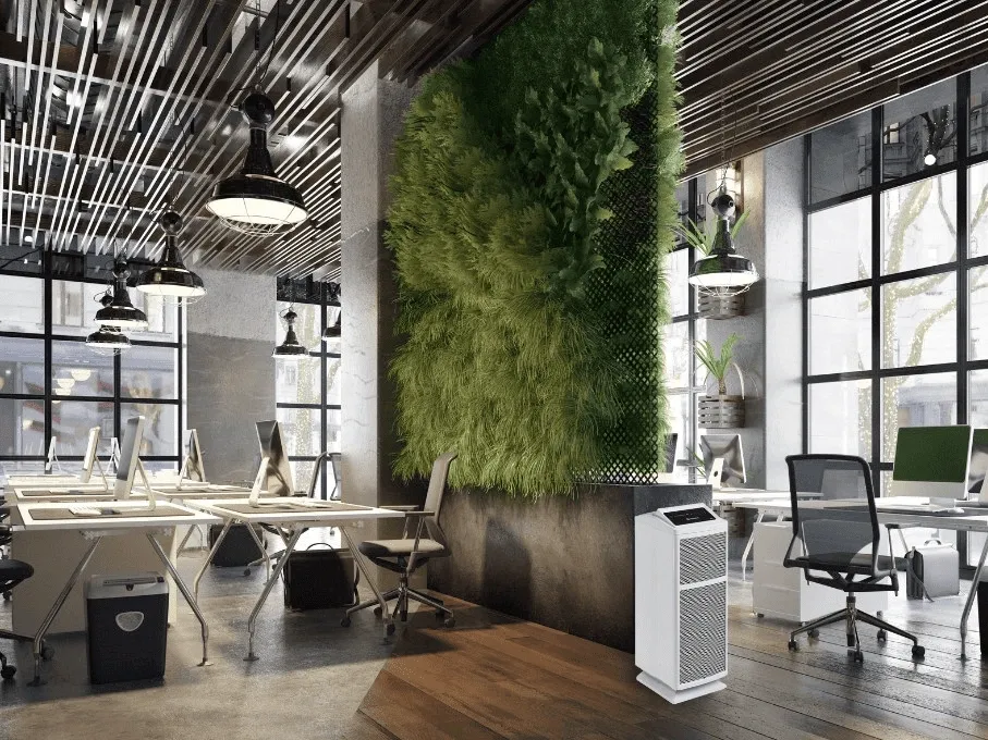 a modern office with a green wall and an air purifier.