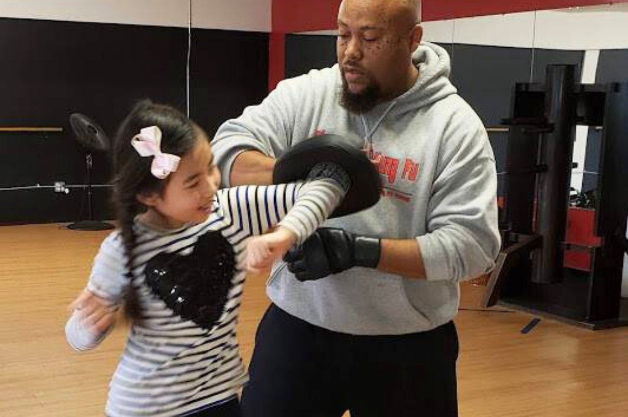 Martial arts instructor with kids
