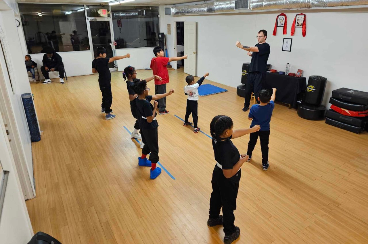 Martial arts instructor with kids