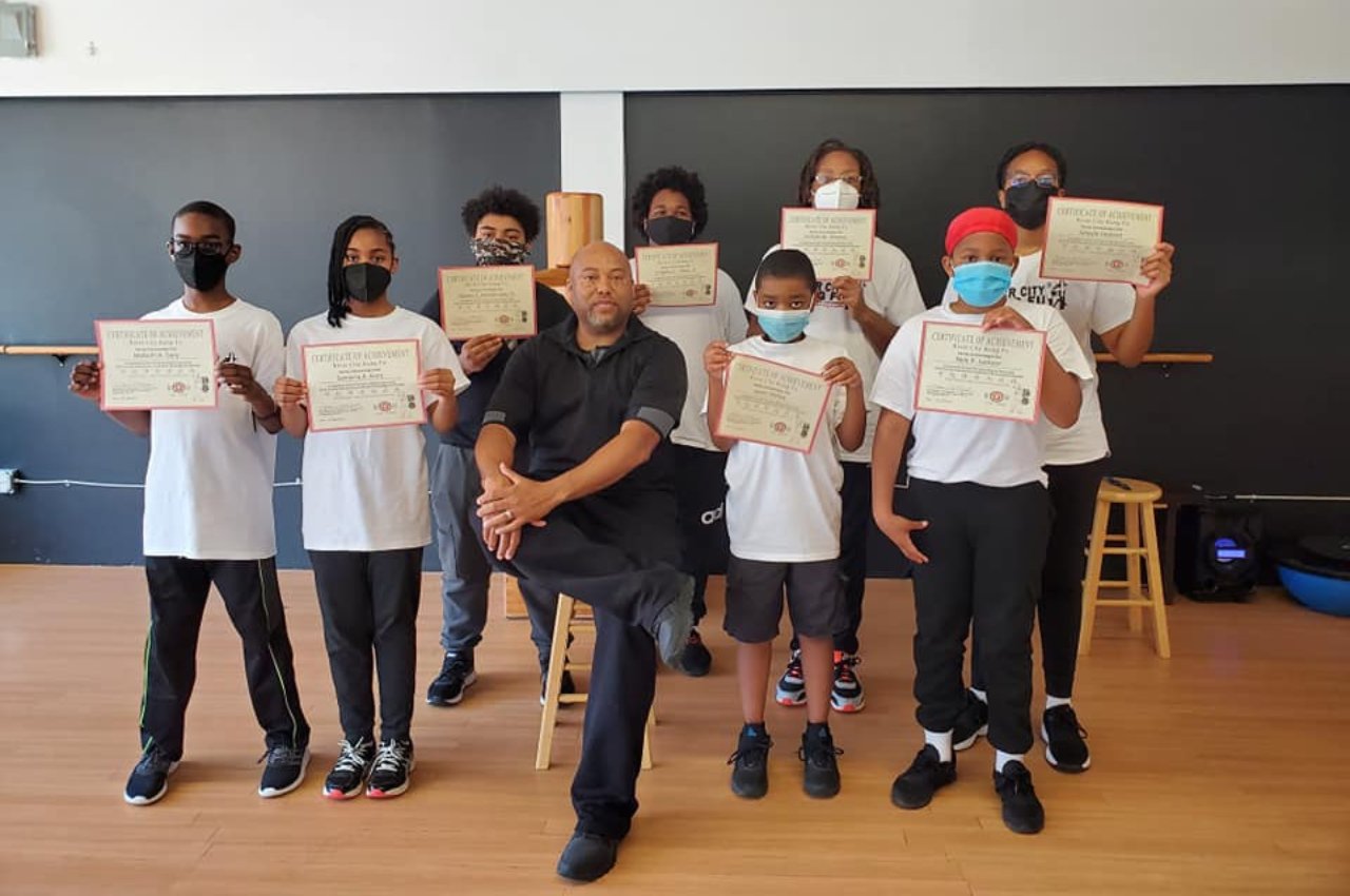 Martial arts instructor with kids