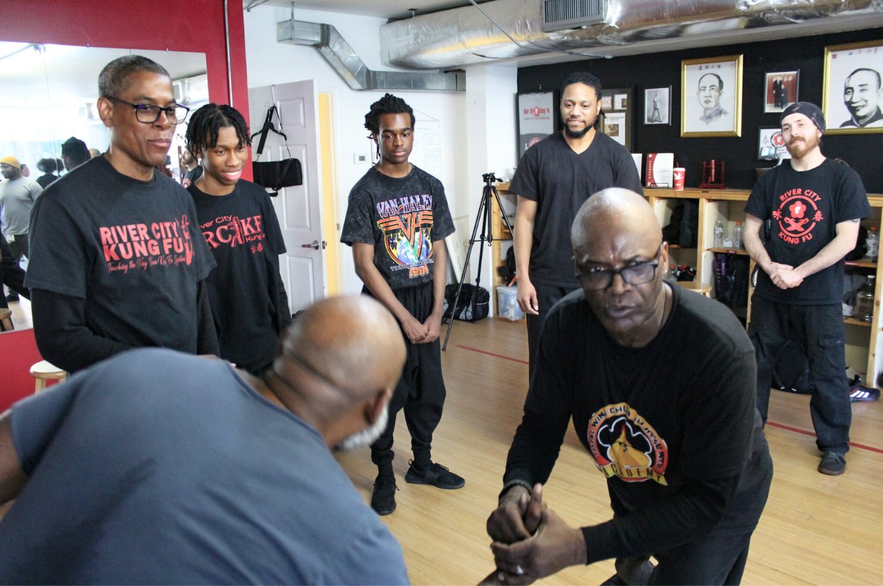 Martial arts instructor with kids