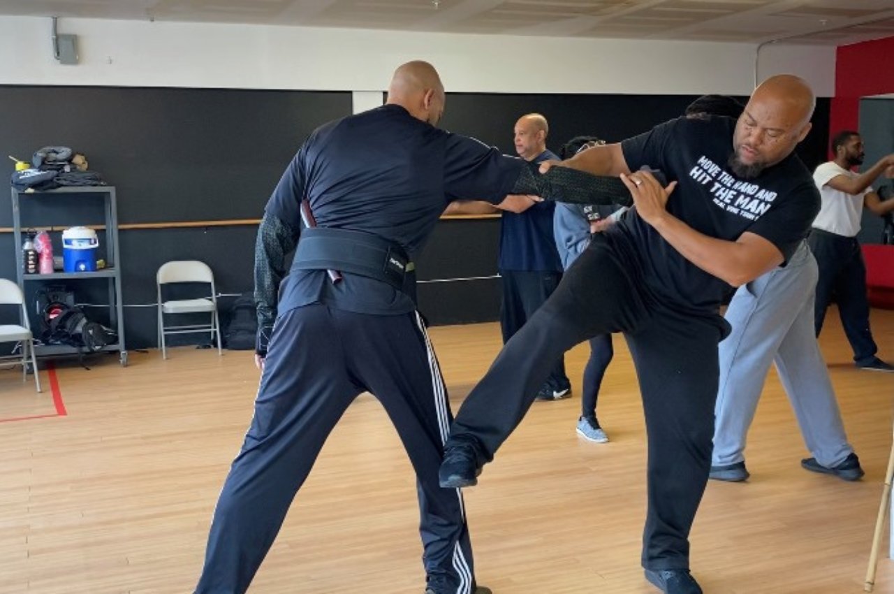 Martial arts instructor with kids