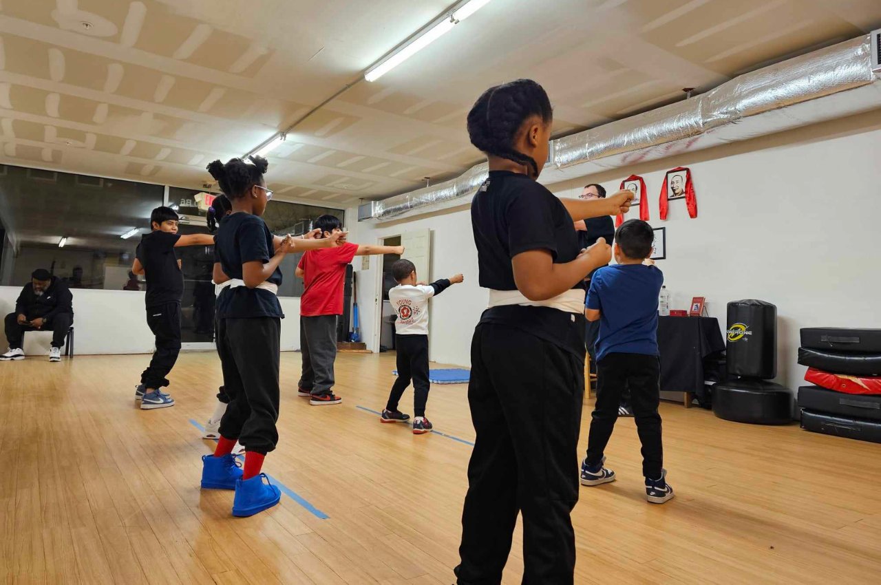 Martial arts instructor with kids