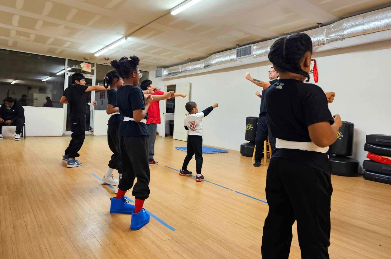 Martial arts instructor with kids