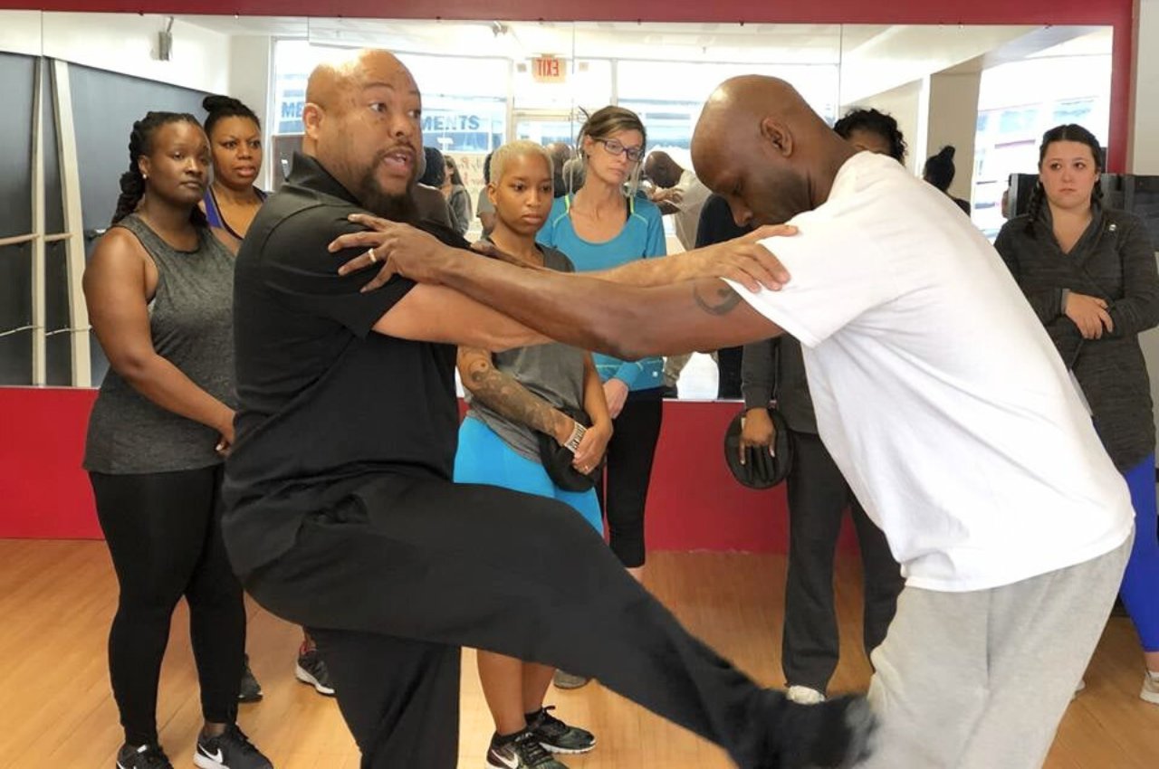 Martial arts instructor with kids