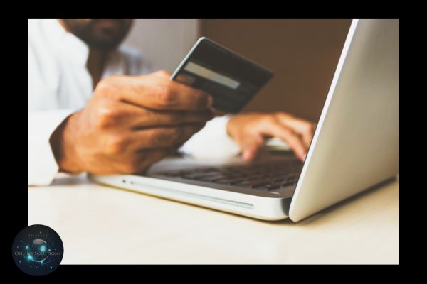 A person holding a credit card while using a laptop, symbolizing online transactions. This image relates to the blog's focus on how a Web Chat Widget can enhance customer experience, provide instant support, and boost online sales.