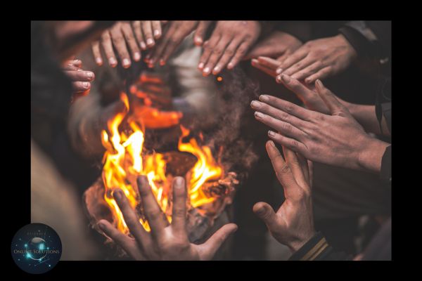 A group of hands warming around a fire, symbolizing the blog's emphasis on cultivating warm introductions and meaningful connections. This image reflects the rejection of cold calls in favor of building trust through referrals and personal interactions.