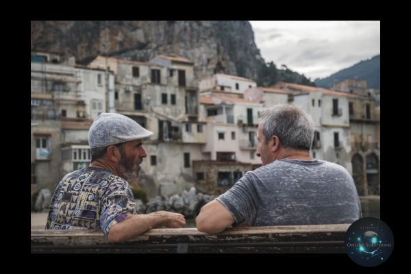 Two men sitting and having a conversation, symbolizing personalized communication. This image reflects the blog's emphasis on how a Web Chat Widget enables real-time, meaningful interactions with customers, enhancing their experience and building trust.
