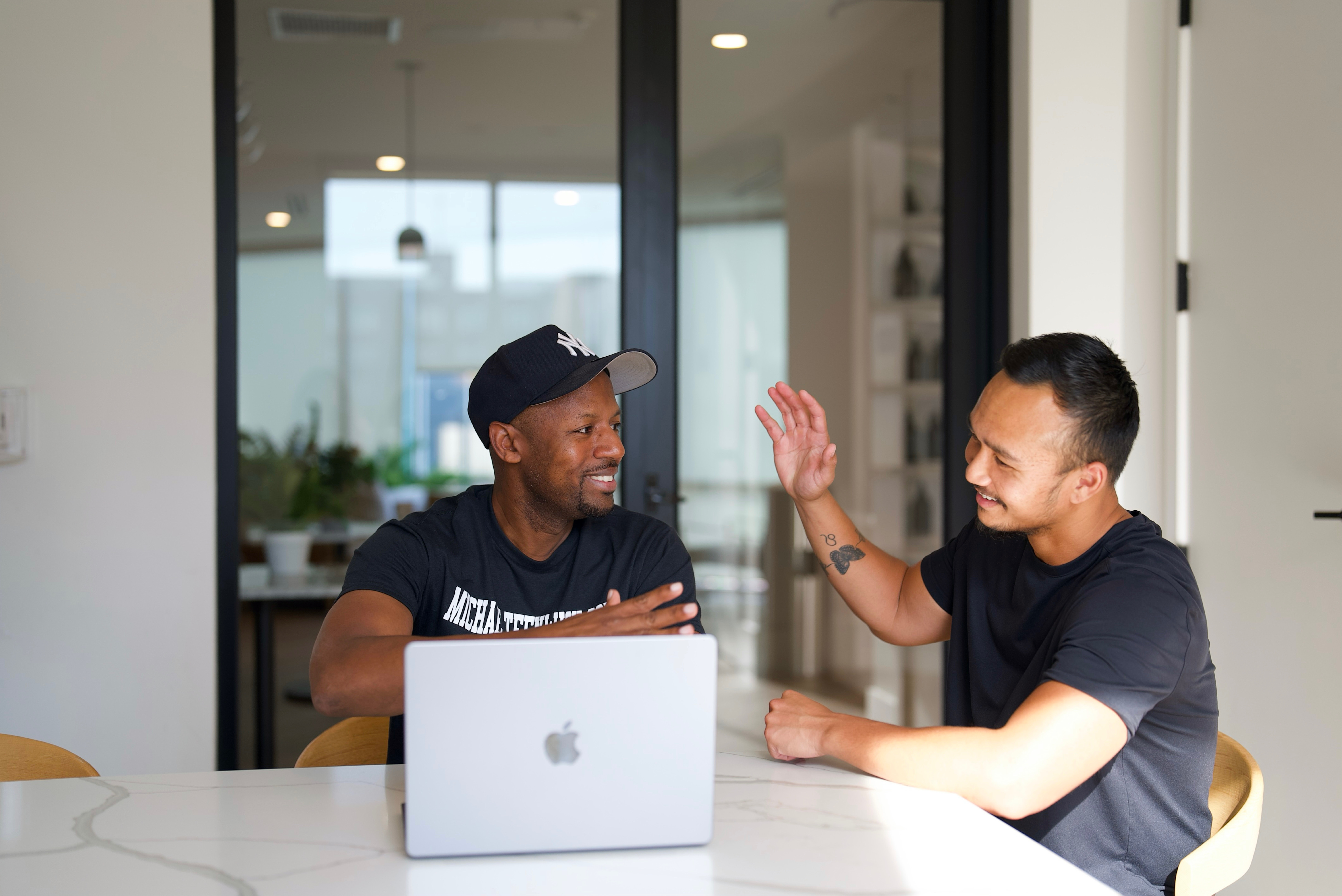 Mike high-fiving client