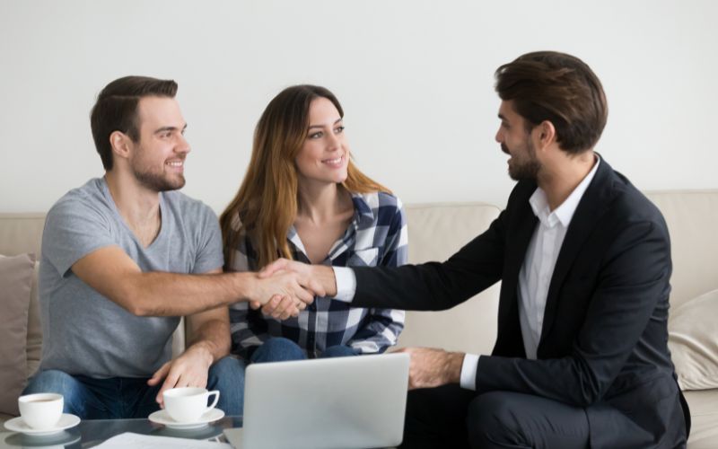 Investor sitting down with couple