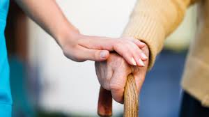 holding elderly's hands