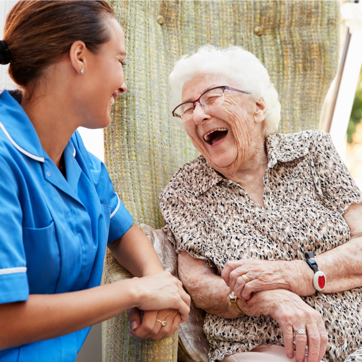 an elderly woman laughing