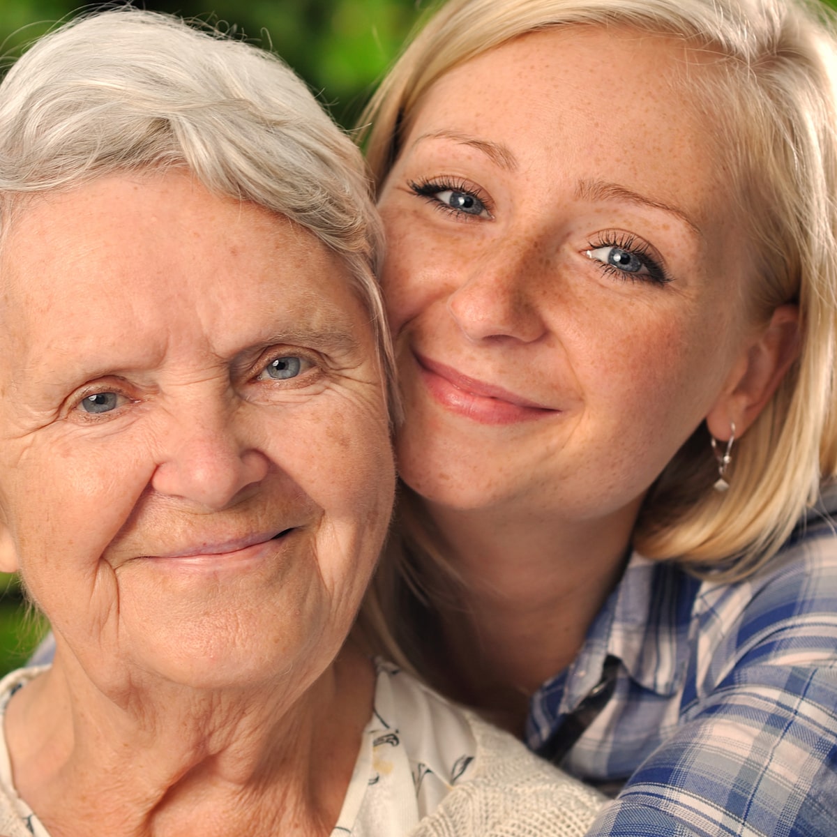 caregiver hugging an elderly patient