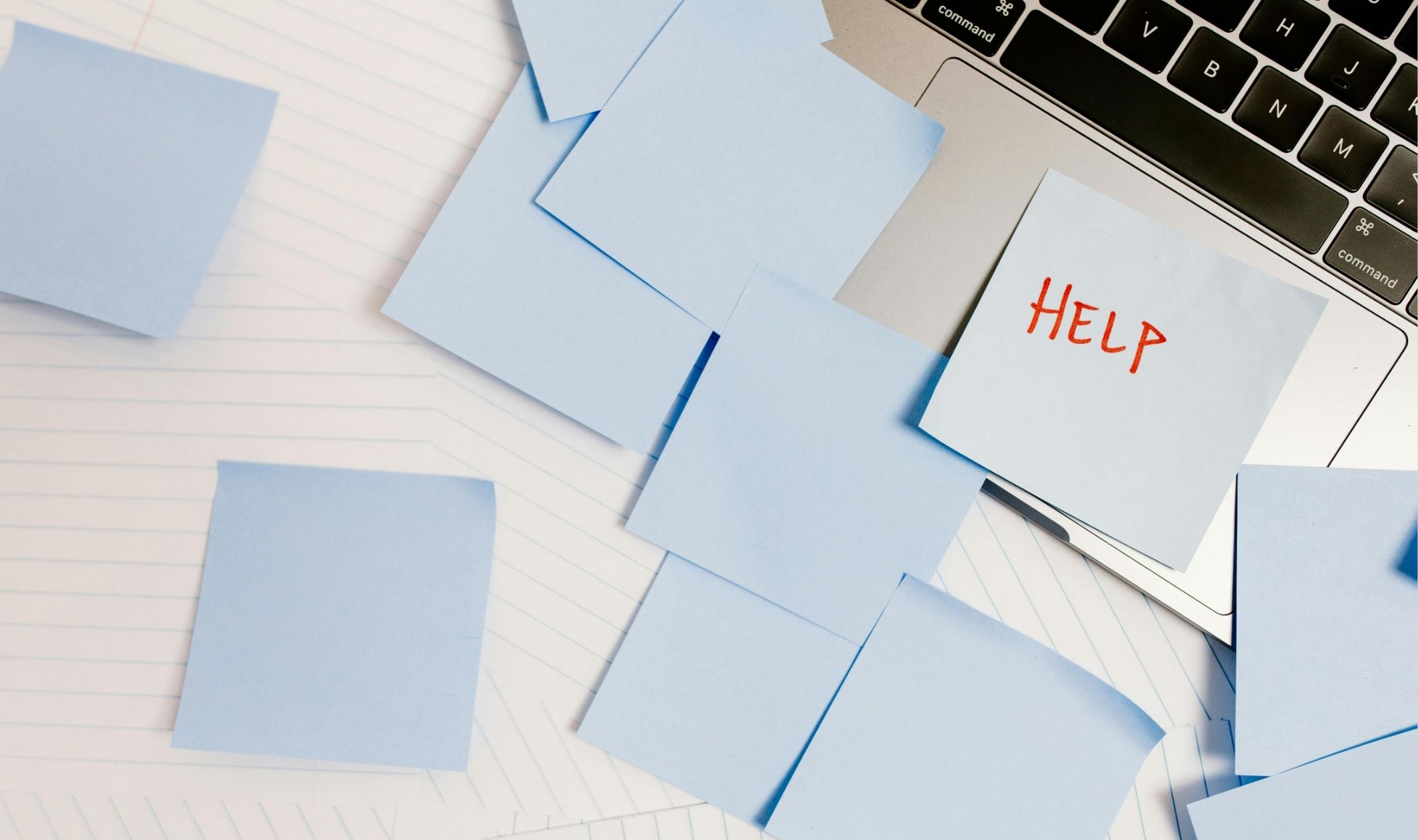 A note on a laptop asking for help, one of many common startup challenges for entrepreneurs A note on a laptop asking for help, one of many common startup challenges for entrepreneurs