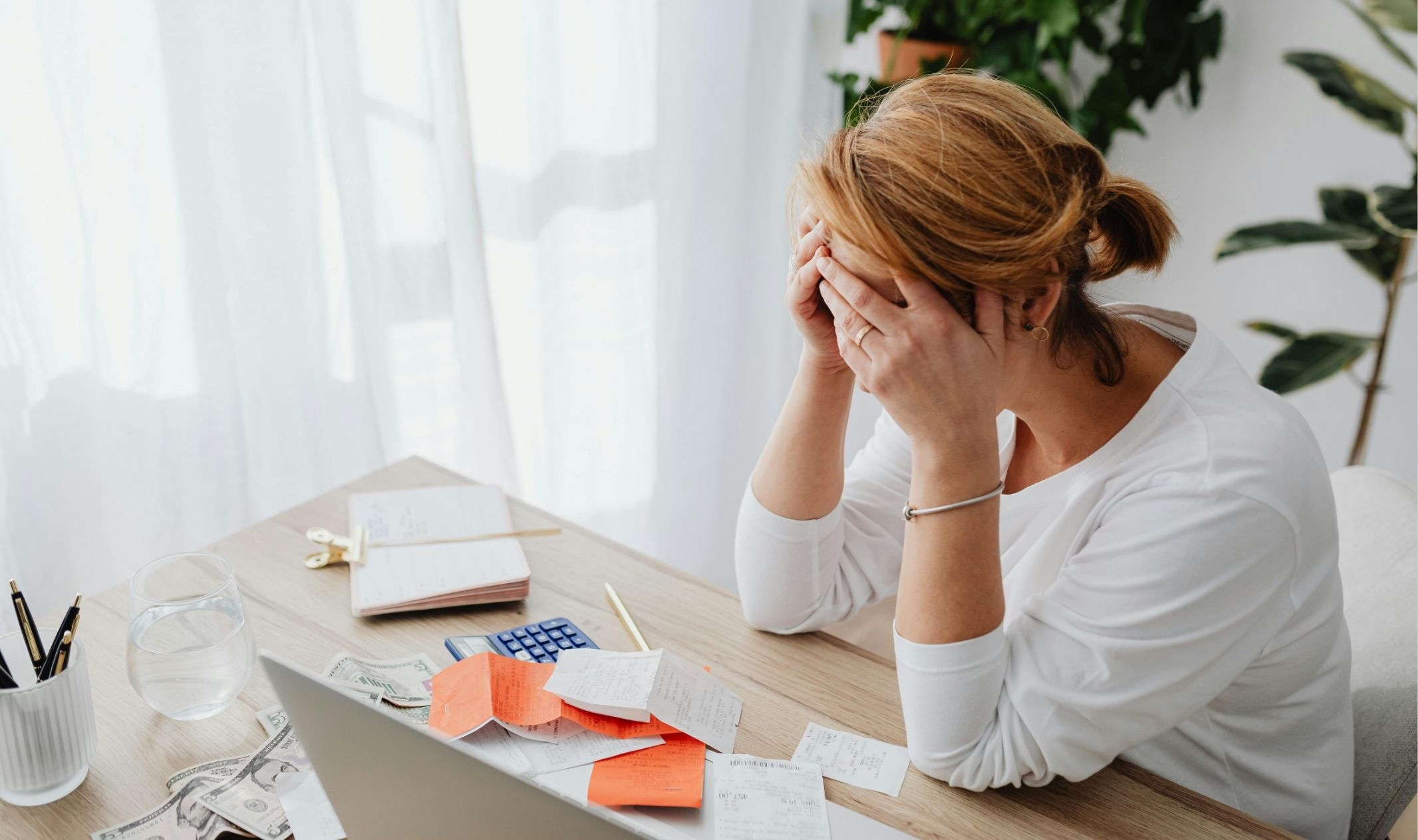A business woman experiencing information overload as a first-time online business owner A business woman experiencing information overload as a first-time online business owner