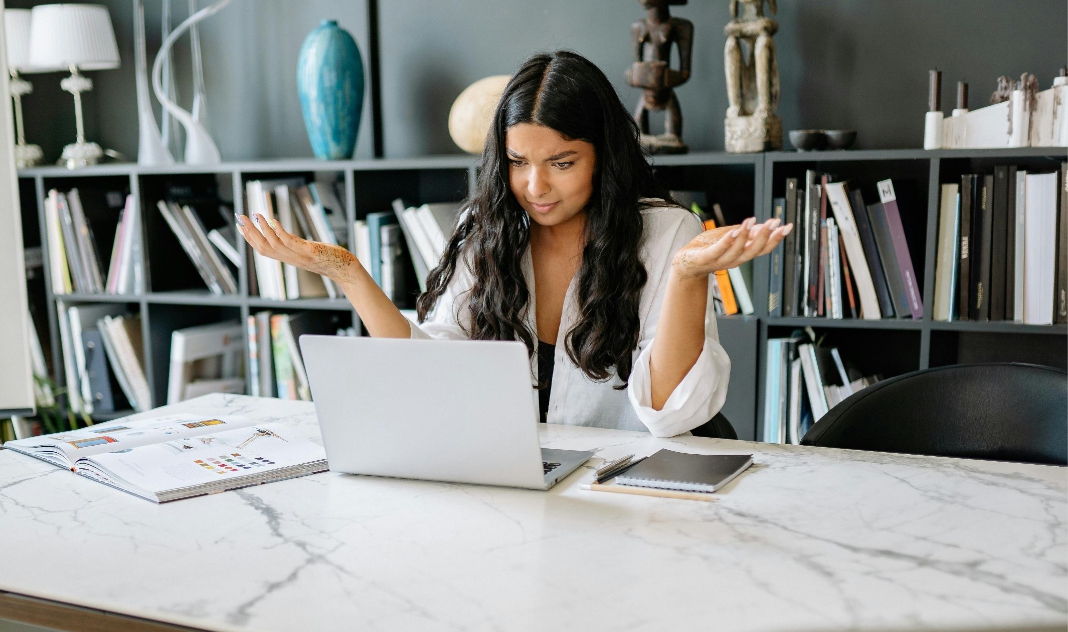 A business woman looking confused while learning the difference between website vs funnel