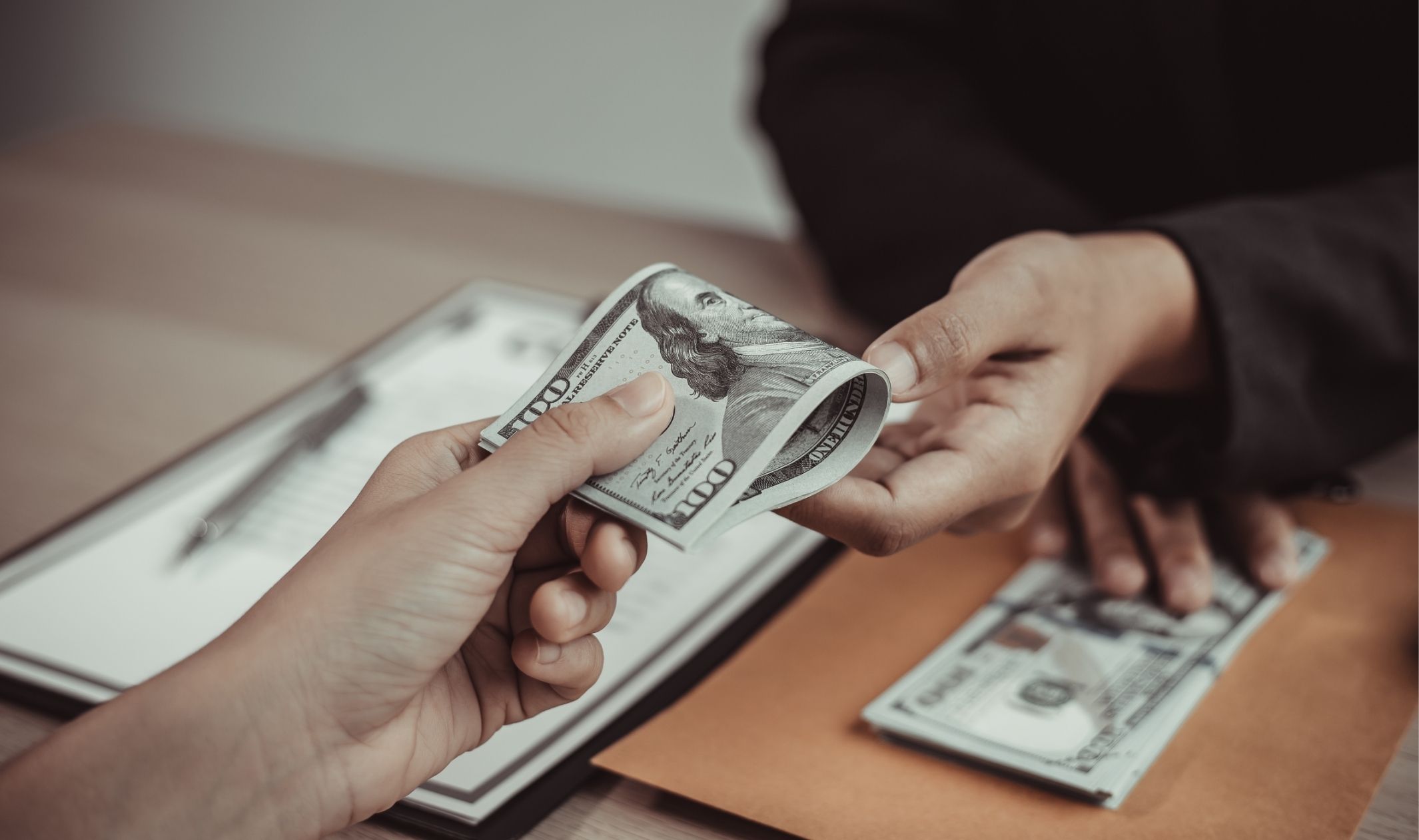Two people demonstrating how to collect payments from clients