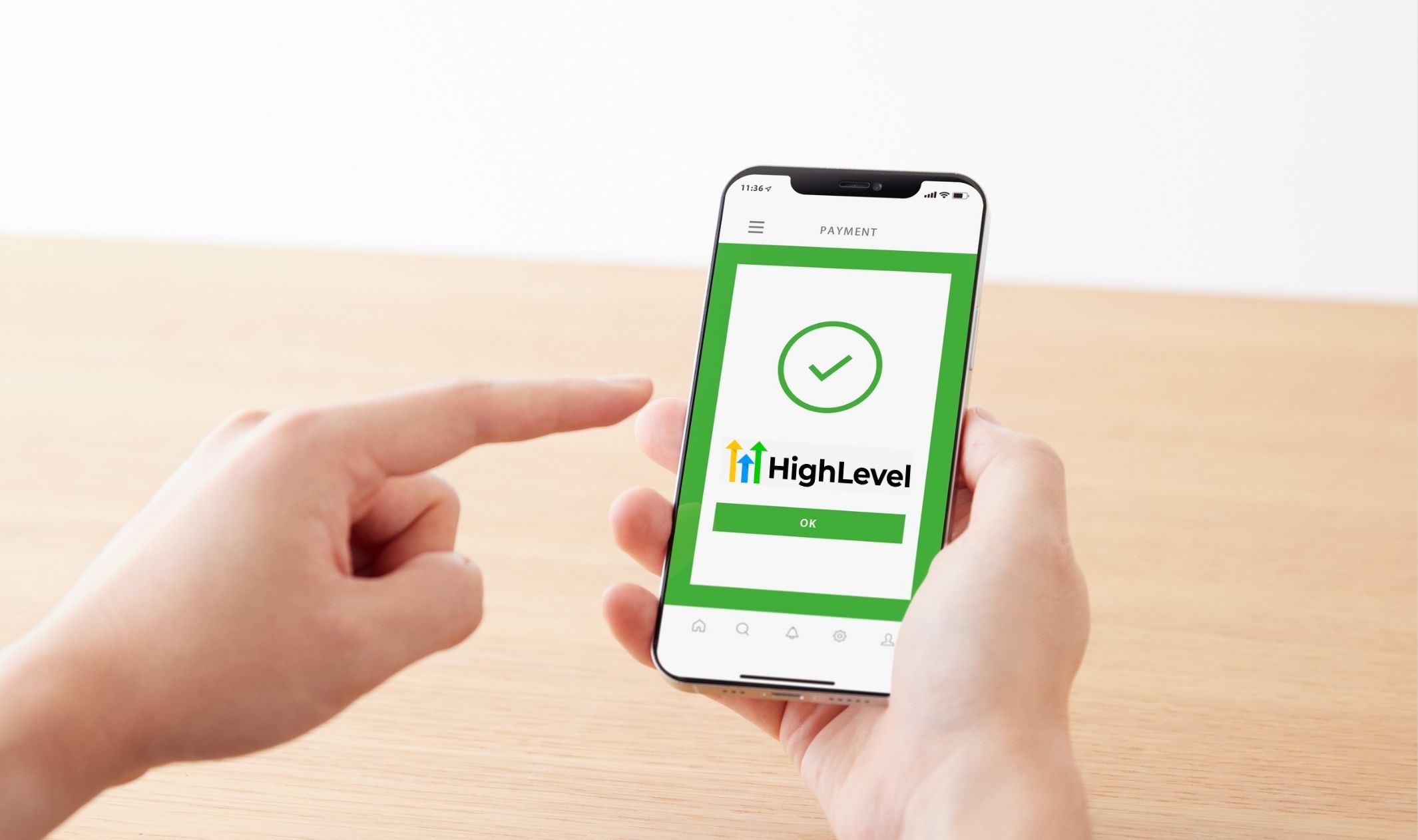 A phone showing a Go HighLevel payment setup
