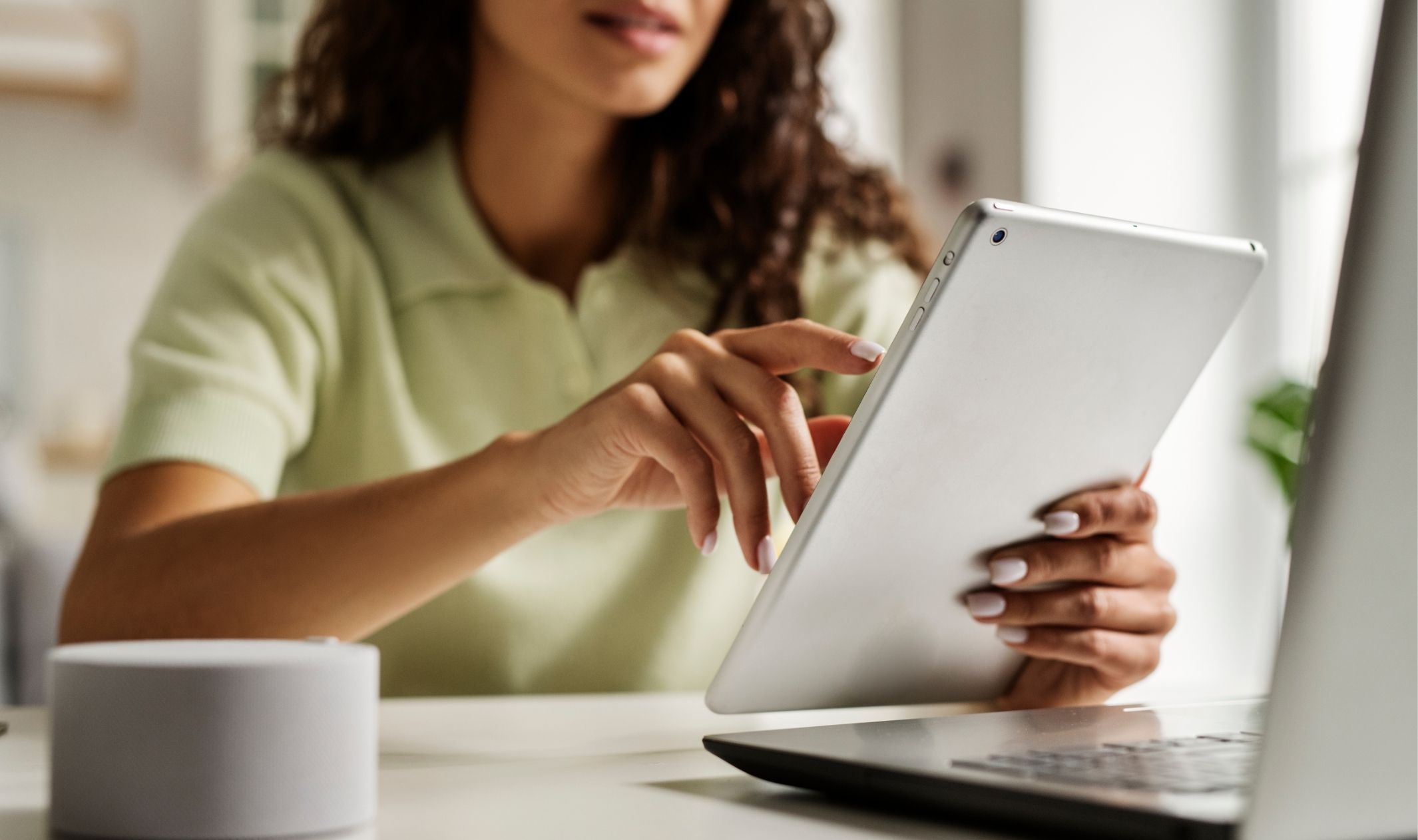 A woman filling out a lead capture quiz on a tablet A woman filling out a lead capture quiz on a tablet