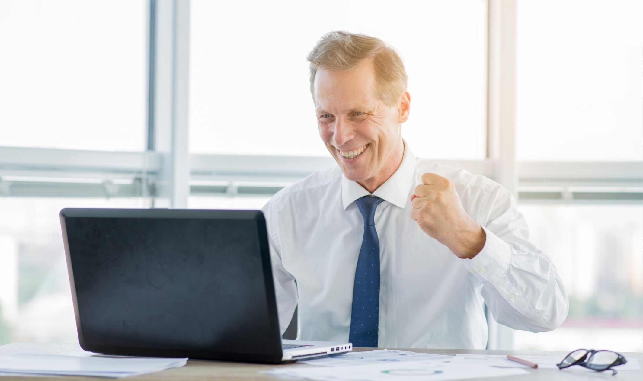 A business man celebrating a successful Go HighLevel email marketing campaign A business man celebrating a successful Go HighLevel email marketing campaign