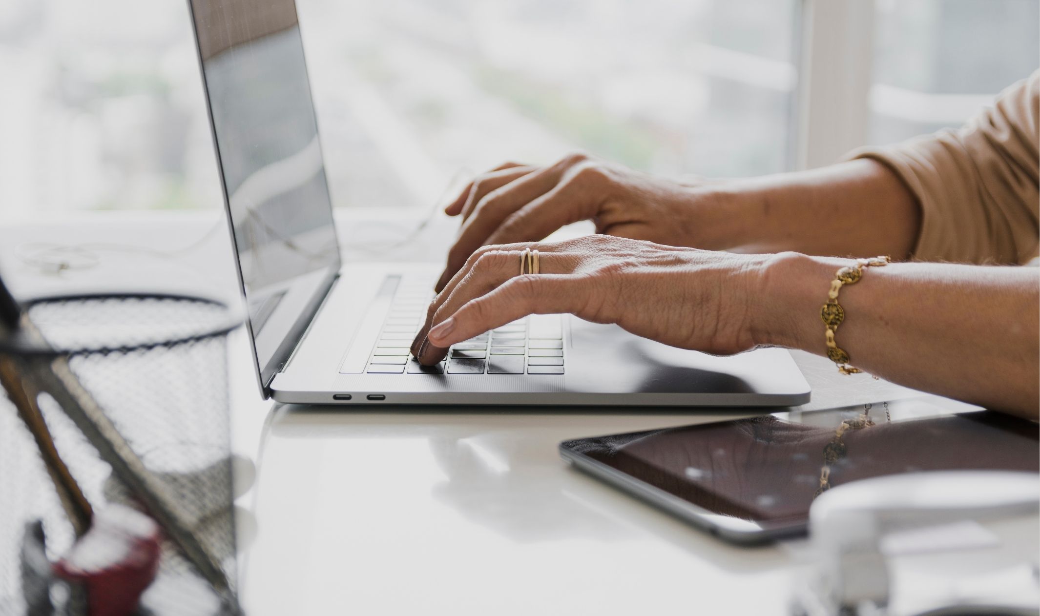 A business woman using a laptop to refine your offer before launch A business woman using a laptop to refine your offer before launch