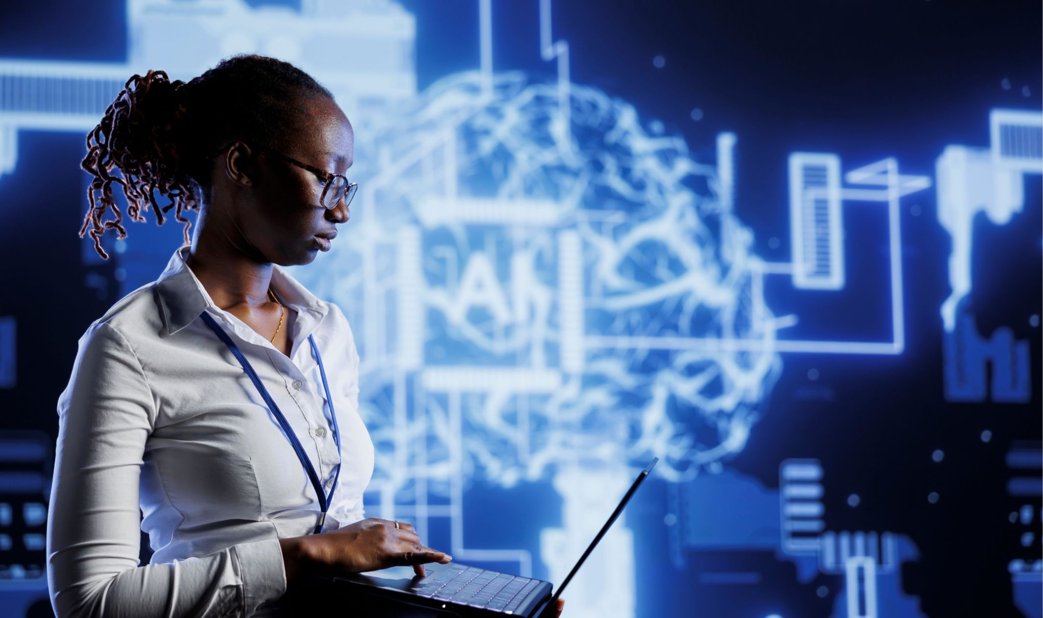 A business owner using AI on her laptop to learn how to how to build a scalable business A business owner using AI on her laptop to learn how to how to build a scalable business