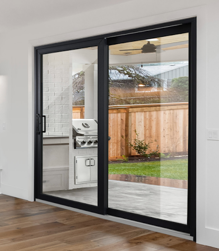 View from inside of an Oakville home looking to the backyard through black trimmed garden sliding doors from Fasada, expanding on the space of the home with elegance. View from inside of an Oakville home looking to the backyard through black trimmed garden sliding doors from Fasada, expanding on the space of the home with elegance.