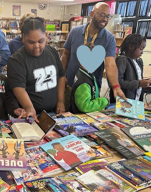 West elementary students and Principle TaRael Kee with new culturally diverse books