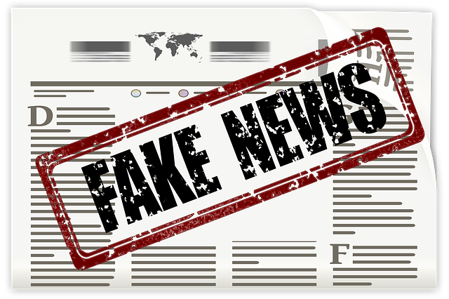 Newspaper with fake news stamped on it Newspaper with fake news stamped on it